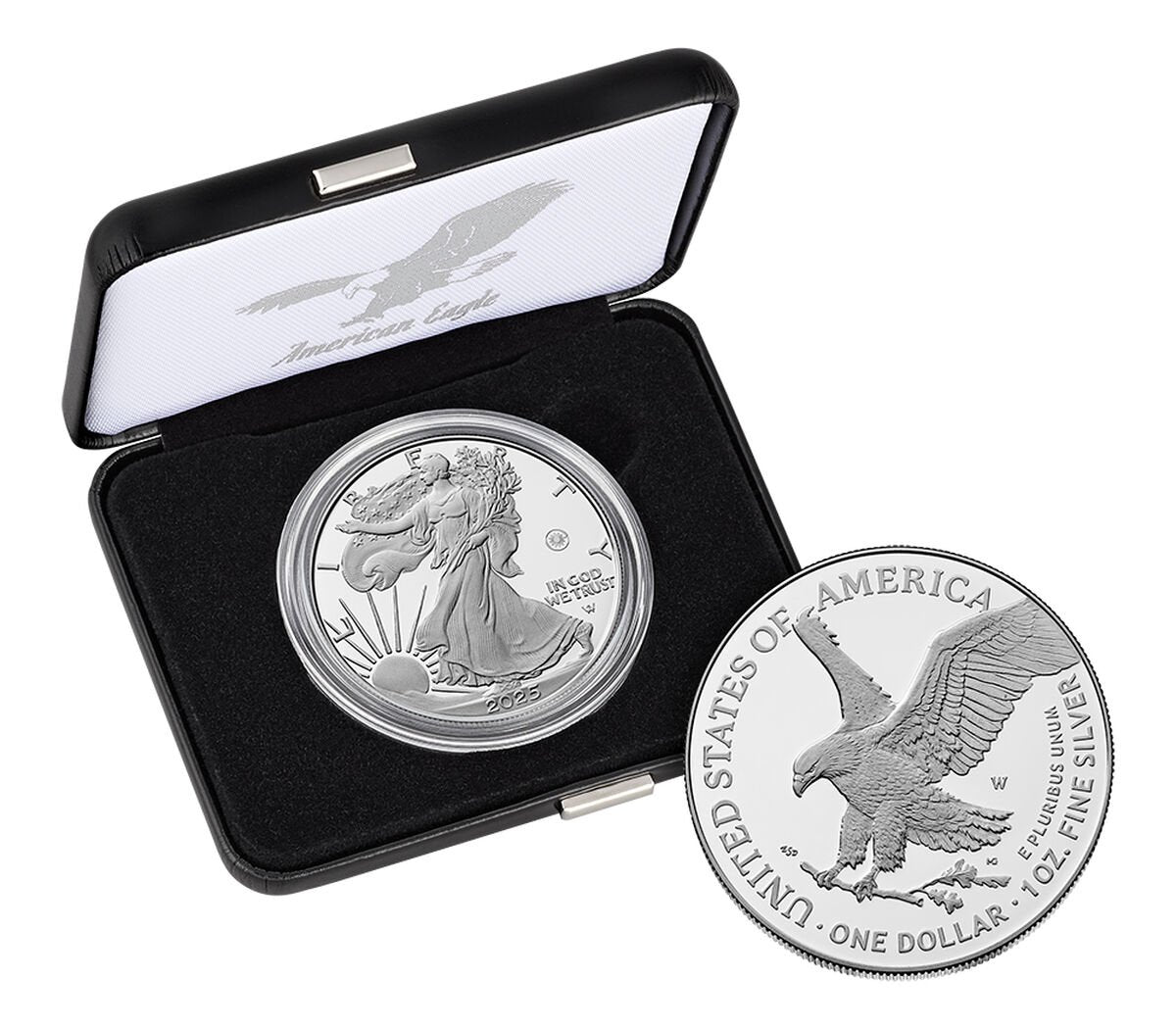 Silver coin with eagle design in a display case